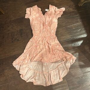 used, like new.
Shorts underneath with high front low back style.